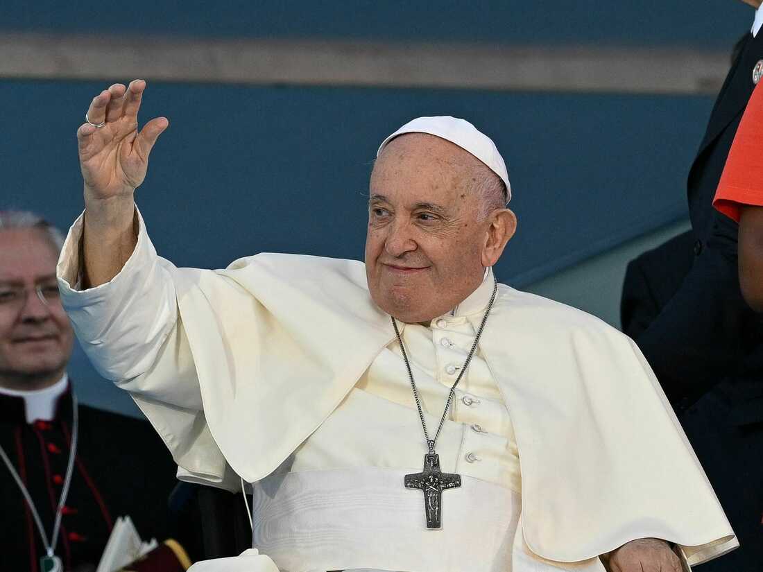 Pope Francis waves as he attends the welcoming ceremony of World Youth Day (WYD) gathering of young Catholics, at Eduardo VII Park in Lisbon on August 3, 2023. Pope Francis today urged young people to focus on caring for the planet and fighting climate change, calling for an "integral ecology" that melds environmental protection with the fight against poverty and other social problems. Around one million pilgrims from around the world will attend the World Youth Day, the largest Catholic gathering in the world, created in 1986 by John Paul II. (Photo by Patricia DE MELO MOREIRA / AFP) (Photo by PATRICIA DE MELO MOREIRA/AFP via Getty Images)